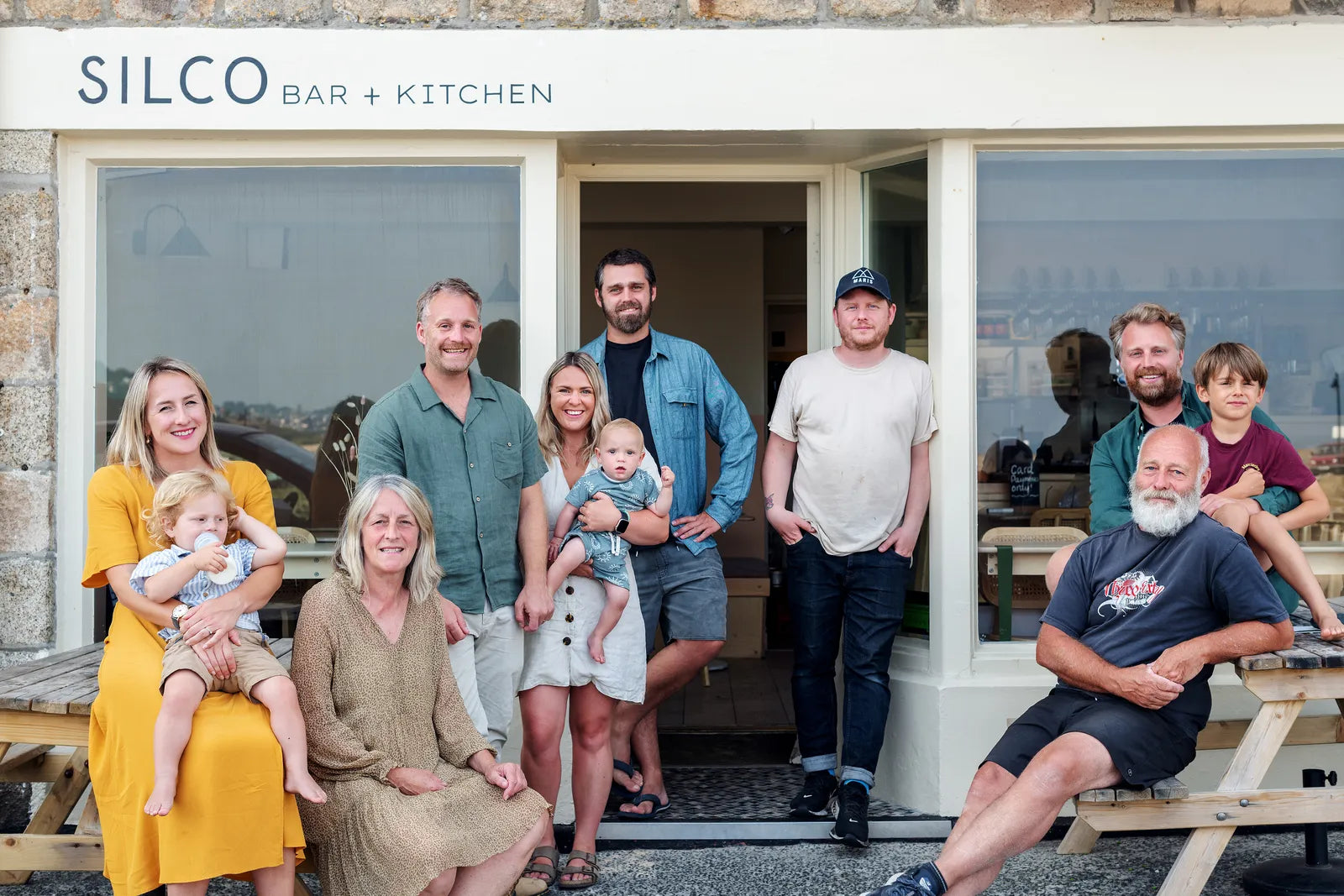 group-of-happy-looking-people-sitting-outside-silco-bar-kitchen-front